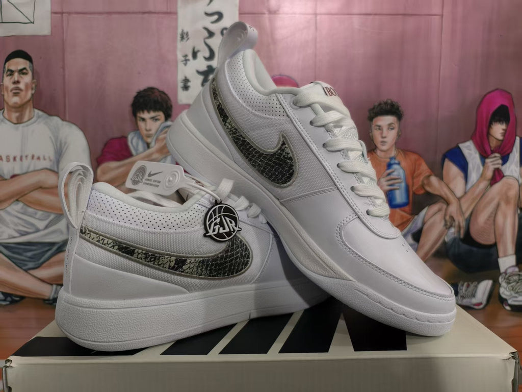 Nike White Low-Top Sneakers with Patterned Swoosh