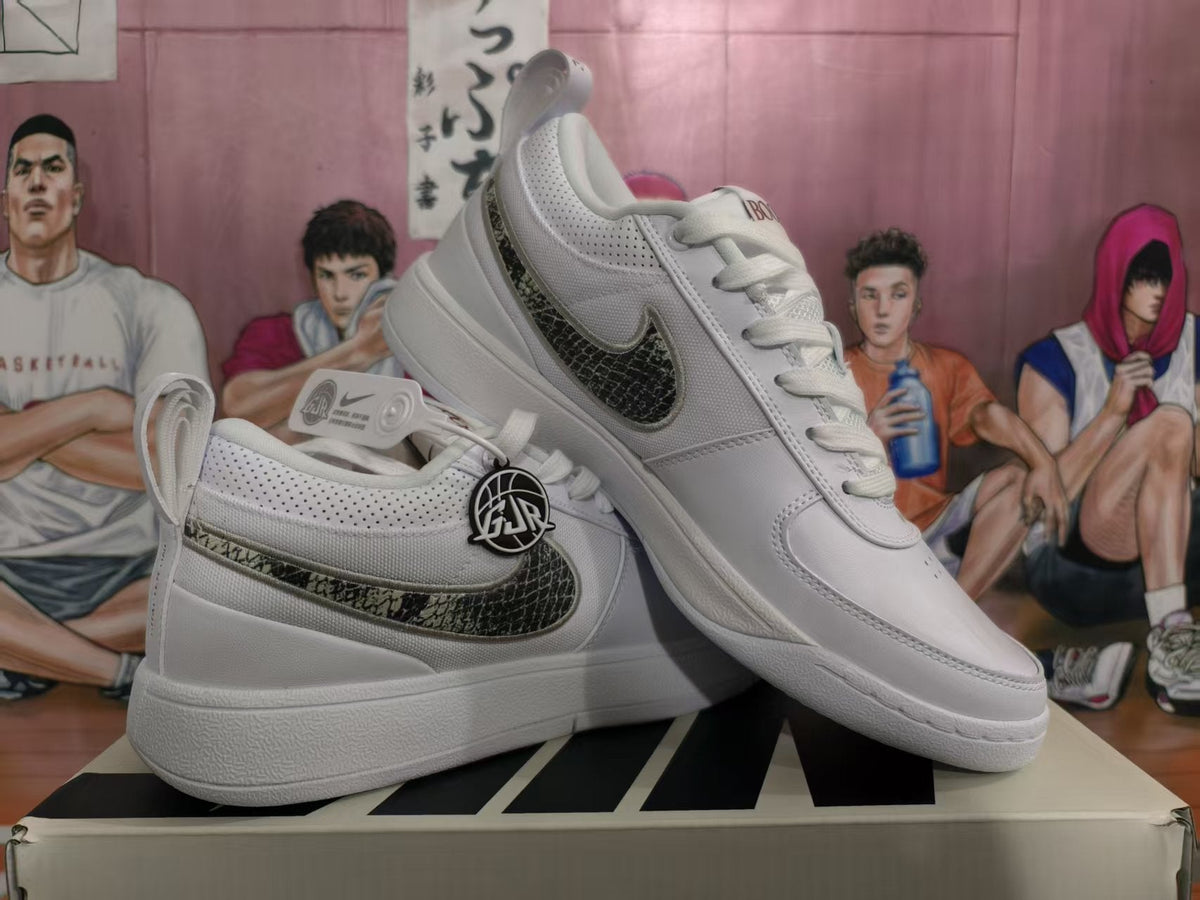 Nike White Low-Top Sneakers with Patterned Swoosh