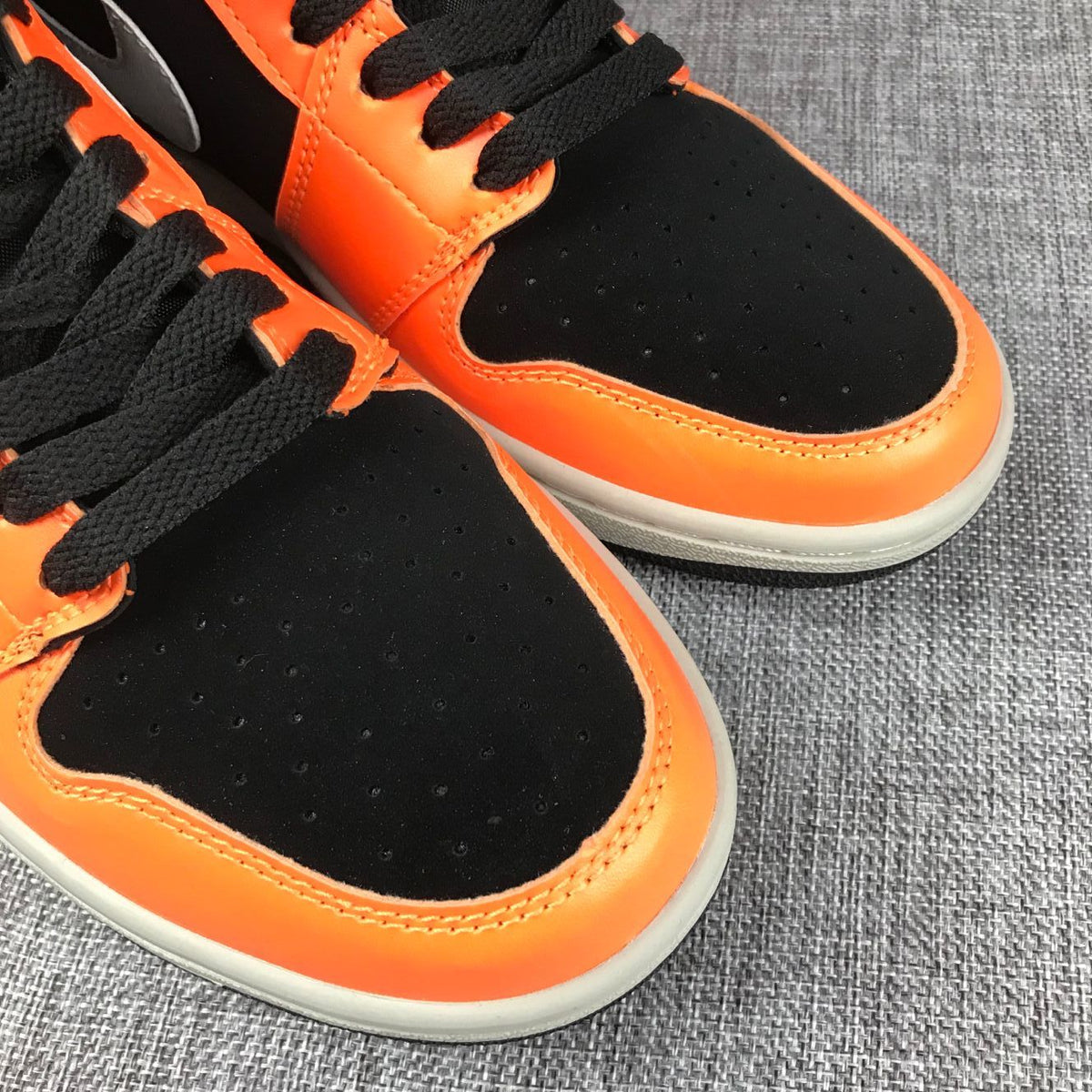 Air Jordan 1 Mid Sneakers in Black, Orange and Grey 554724-062