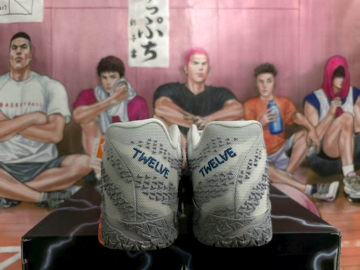 Nike Gray Basketball Sneakers with Blue and Orange Accents