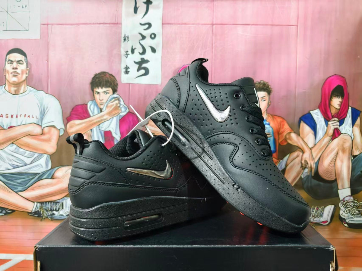 Nike Black Low-Top Sneakers with Metallic Swoosh