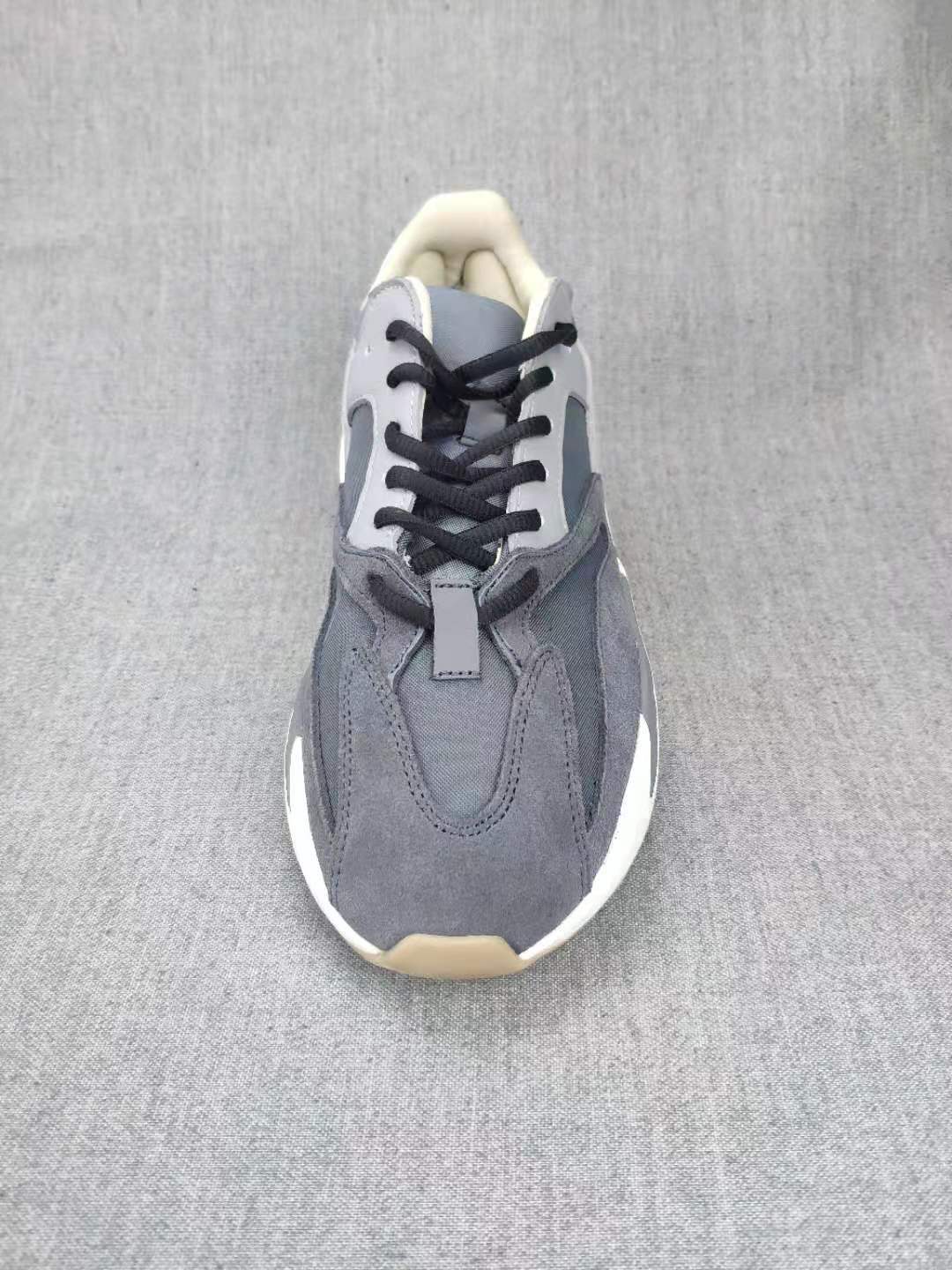700 Grey Lifestyle Sneakers with Orange Accents