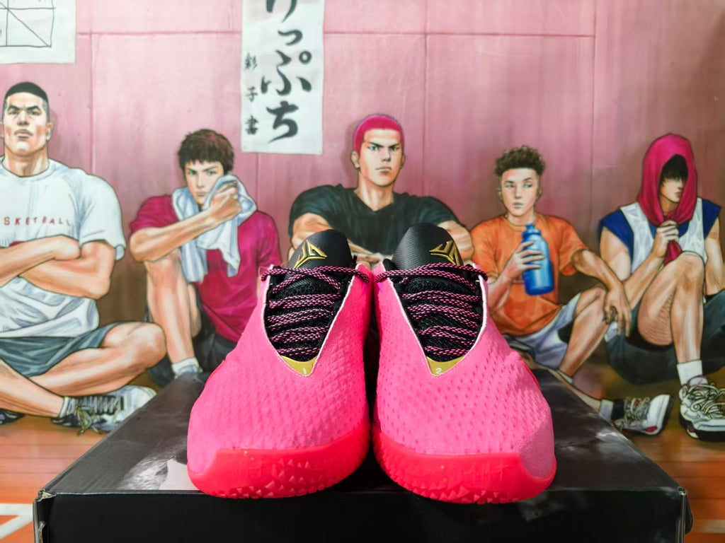 Nike Pink and Gold Basketball Shoes