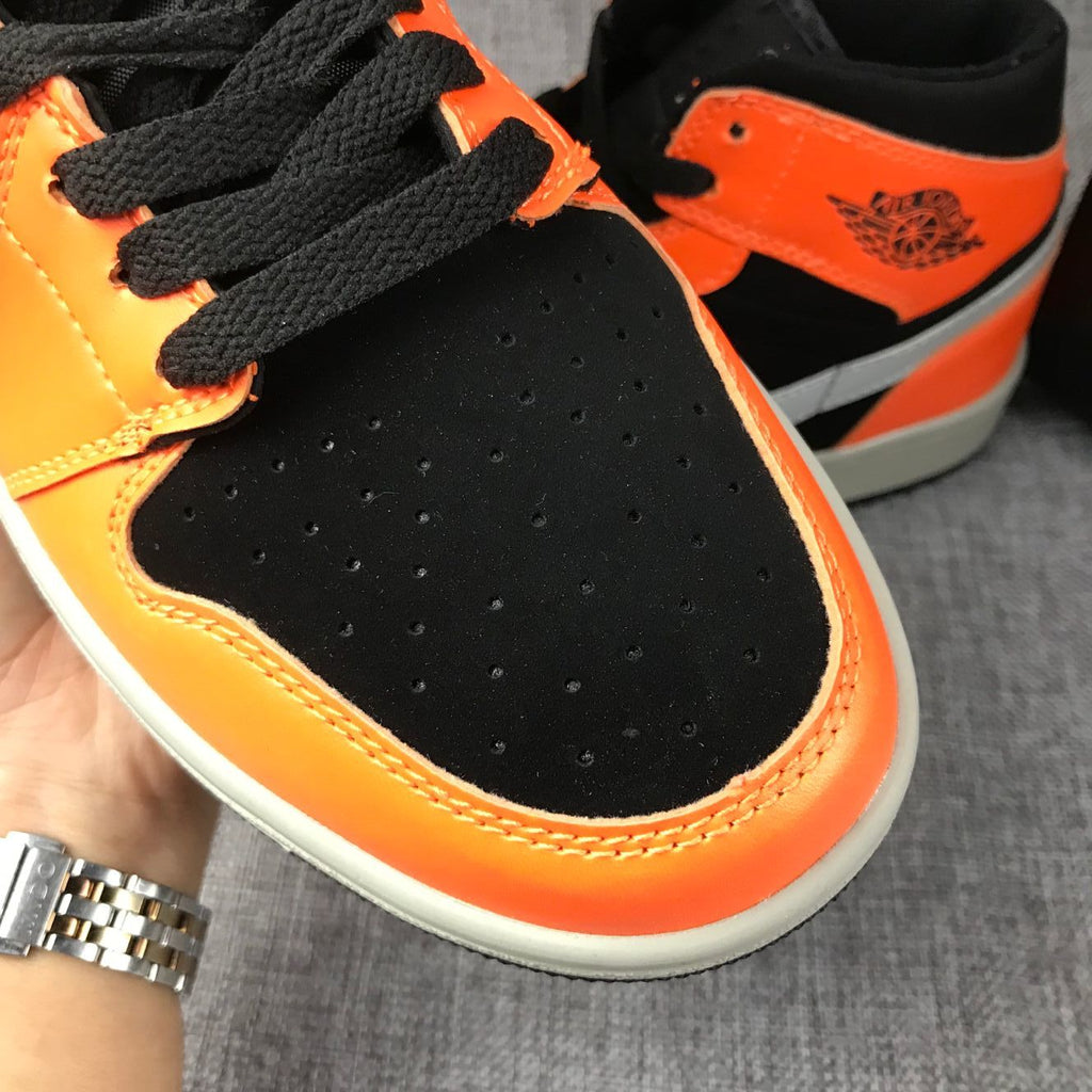 Air Jordan 1 Mid Sneakers in Black, Orange and Grey 554724-062